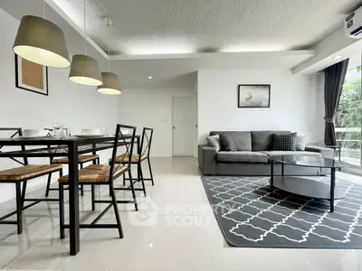 Modern living room with stylish dining area and cozy sofa