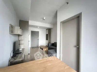 Modern living room with sleek furniture and neutral tones, perfect for urban living.