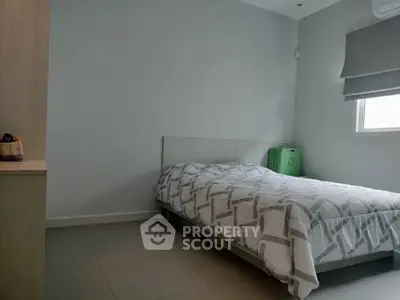 Cozy bedroom with modern decor and natural light