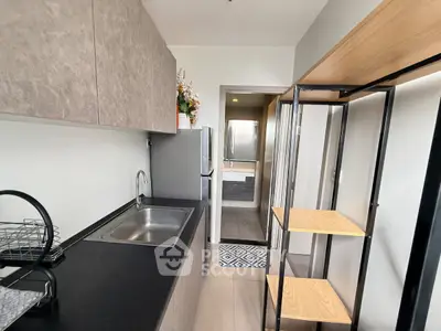 Modern kitchen with sleek design and open layout, featuring stainless steel appliances and ample storage space.