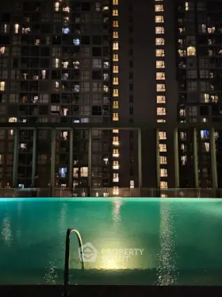 Luxurious rooftop pool with stunning cityscape views at night