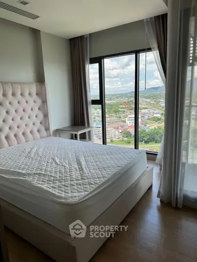Luxurious bedroom with stunning city view and elegant decor