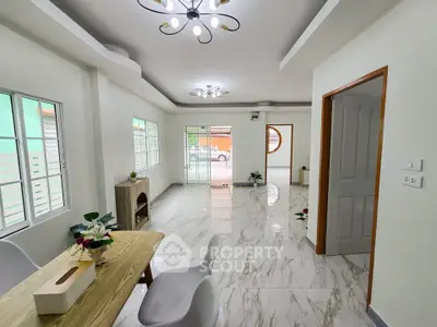 Spacious modern living room with elegant dining area and marble flooring