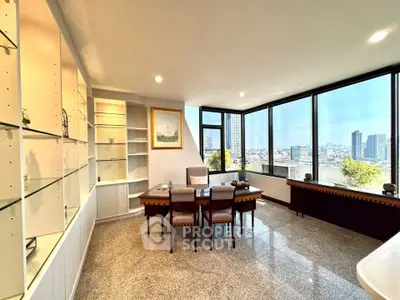 Spacious corner unit with panoramic city views and elegant dining area.