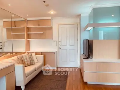 Modern living room with stylish wooden shelves and cozy sofa in a bright apartment.