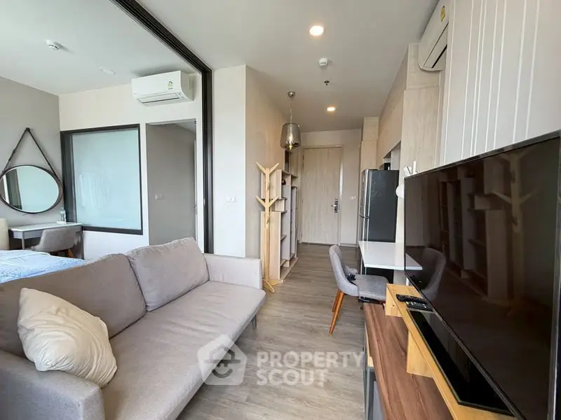 Modern living room with stylish decor and open layout in a contemporary apartment.