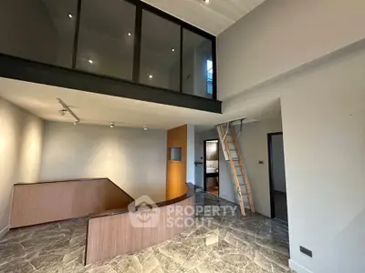 Modern duplex interior with mezzanine and marble flooring