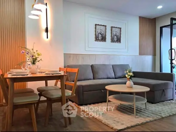Stylish living room with modern decor and cozy dining area, perfect for entertaining guests.
