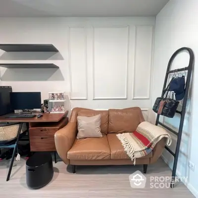 Cozy study room with leather sofa and modern desk setup