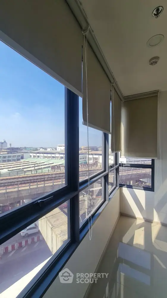 Bright corner unit with expansive windows offering panoramic city views, perfect for natural light lovers.