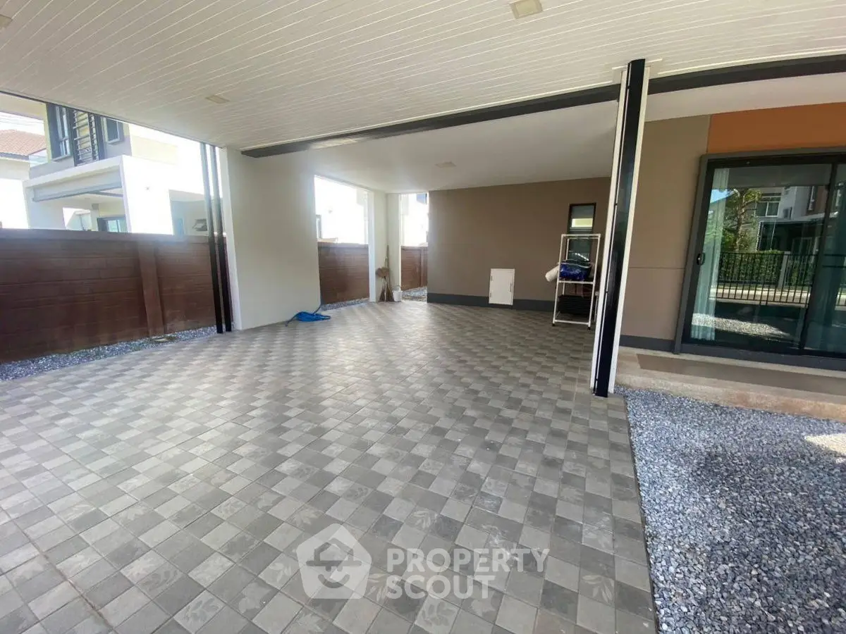 Spacious covered parking area with tiled flooring and modern design