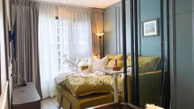 Cozy bedroom with modern decor and large window for natural light