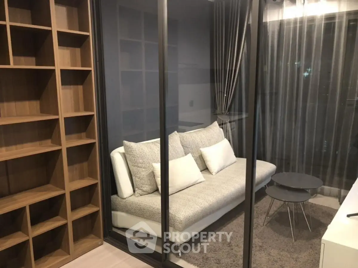 Modern living room with glass partition and cozy sofa