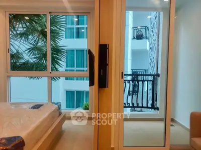 Modern bedroom with balcony view in luxury apartment