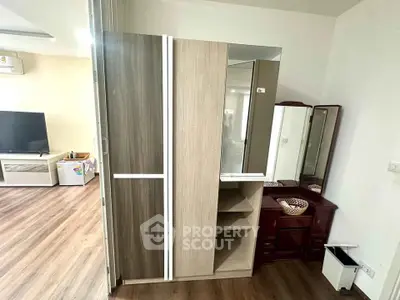 Modern interior with stylish wardrobe and TV in a cozy living space