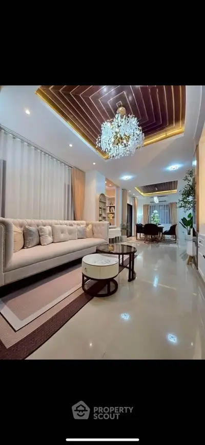Luxurious living room with elegant chandelier and modern decor