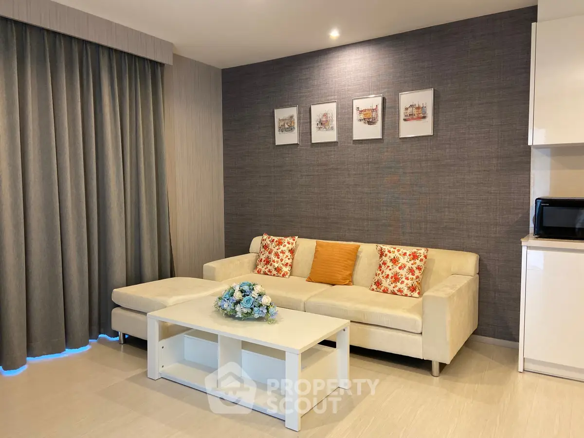 Modern living room with stylish decor and cozy sofa in elegant apartment.