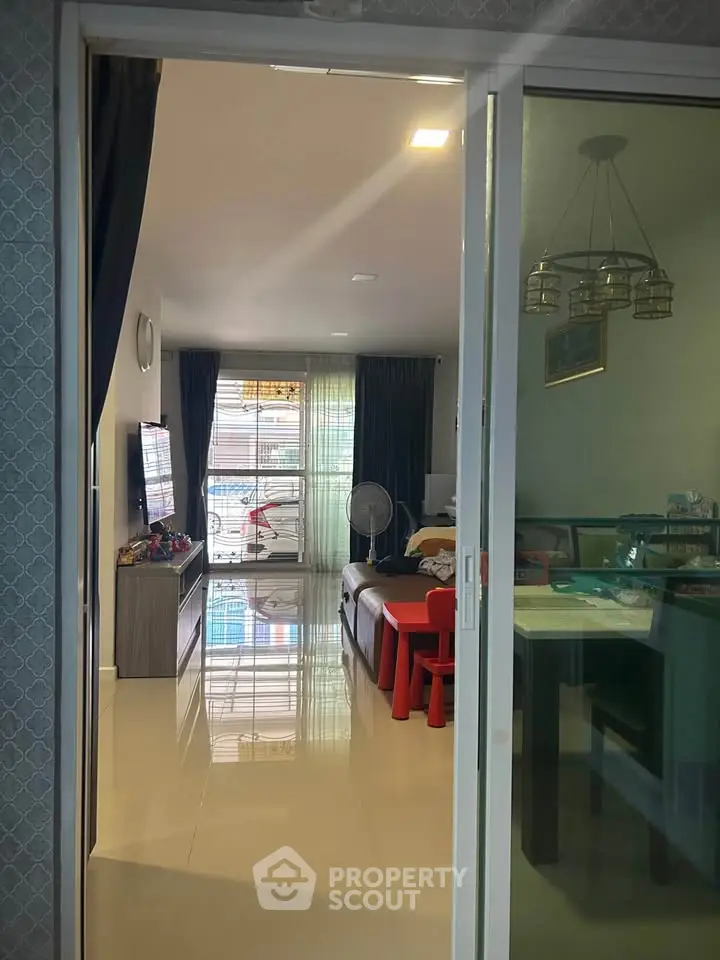 Spacious living room with modern decor and natural light