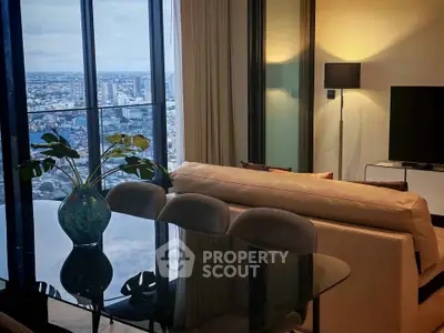 Luxurious living room with stunning city view, modern furniture, and elegant decor in high-rise apartment.