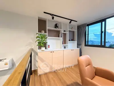 Modern living room with stylish shelving and large window view