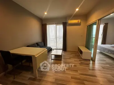 Modern living room with wooden flooring and natural light