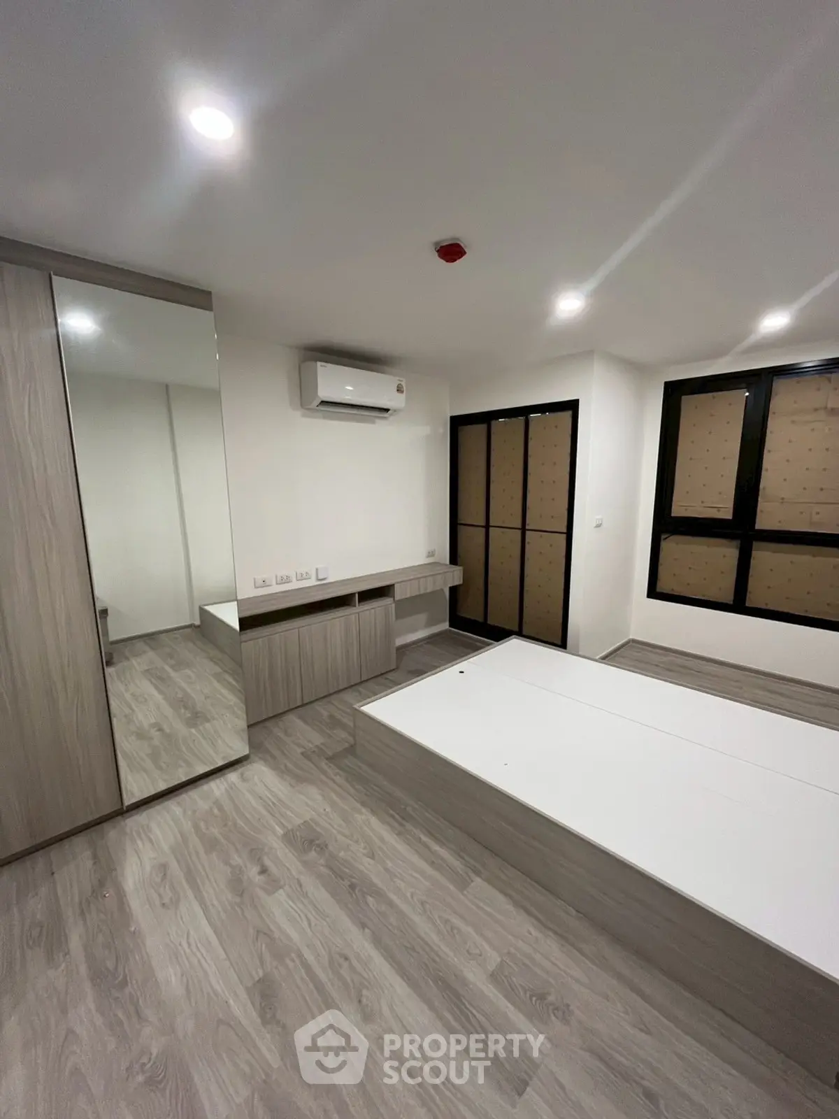 Modern bedroom with sleek design and built-in storage solutions