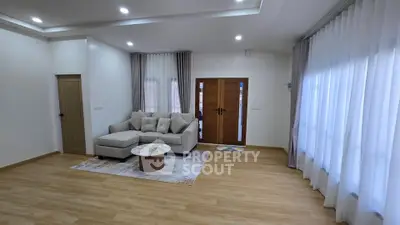 Spacious modern living room with elegant decor and natural light