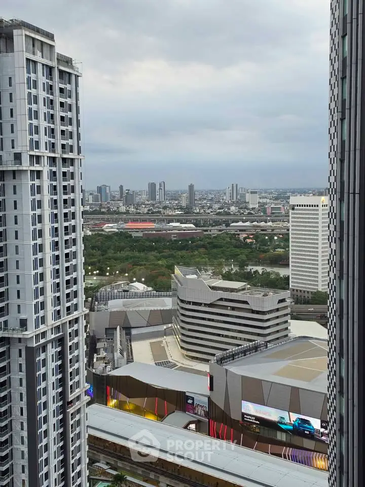 Stunning cityscape view from high-rise building showcasing modern architecture and vibrant urban life.