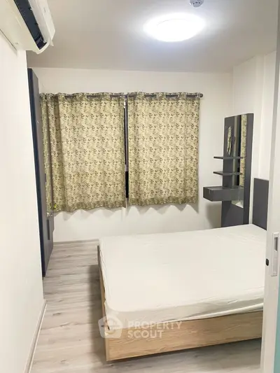 Cozy bedroom with modern decor and ample natural light