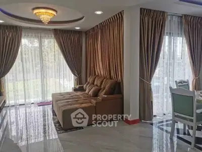 Luxurious living room with elegant curtains and plush sofa in a modern home