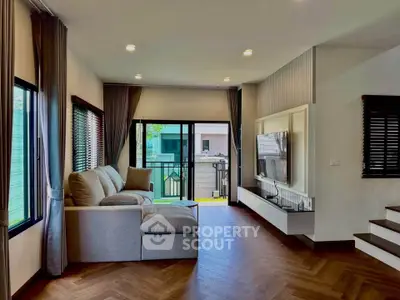 Spacious modern living room with large windows and stylish decor