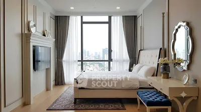 Luxurious bedroom with stunning city view, elegant decor, and ample natural light.