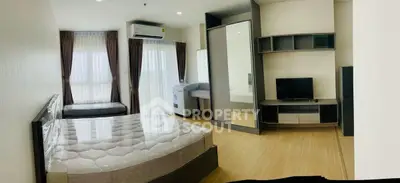 Spacious modern bedroom with large windows and stylish furniture in a contemporary apartment.