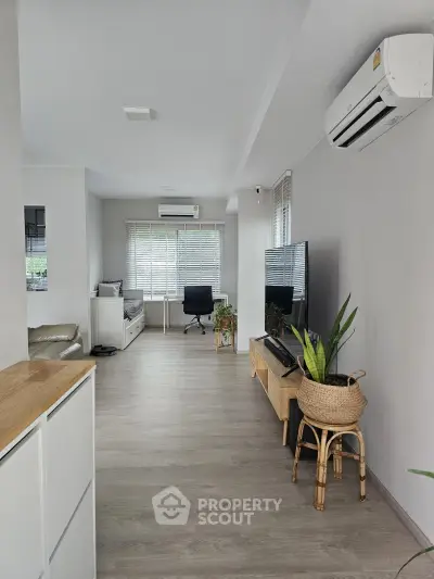 Spacious modern living room with air conditioning and stylish decor
