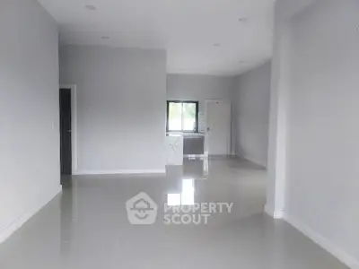 Spacious modern interior with glossy floors and neutral walls, ideal for customization.