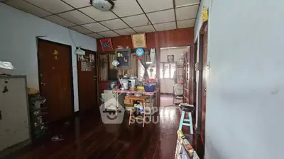 Charming vintage interior with wooden floors and eclectic decor, perfect for creative renovation.