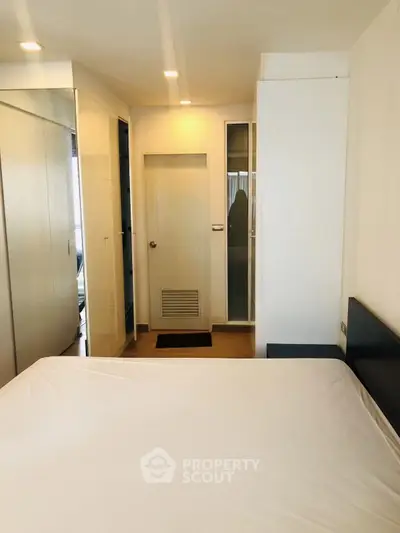 Modern bedroom with minimalist design and ample natural light