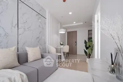 Modern living room with marble accent wall and cozy seating area