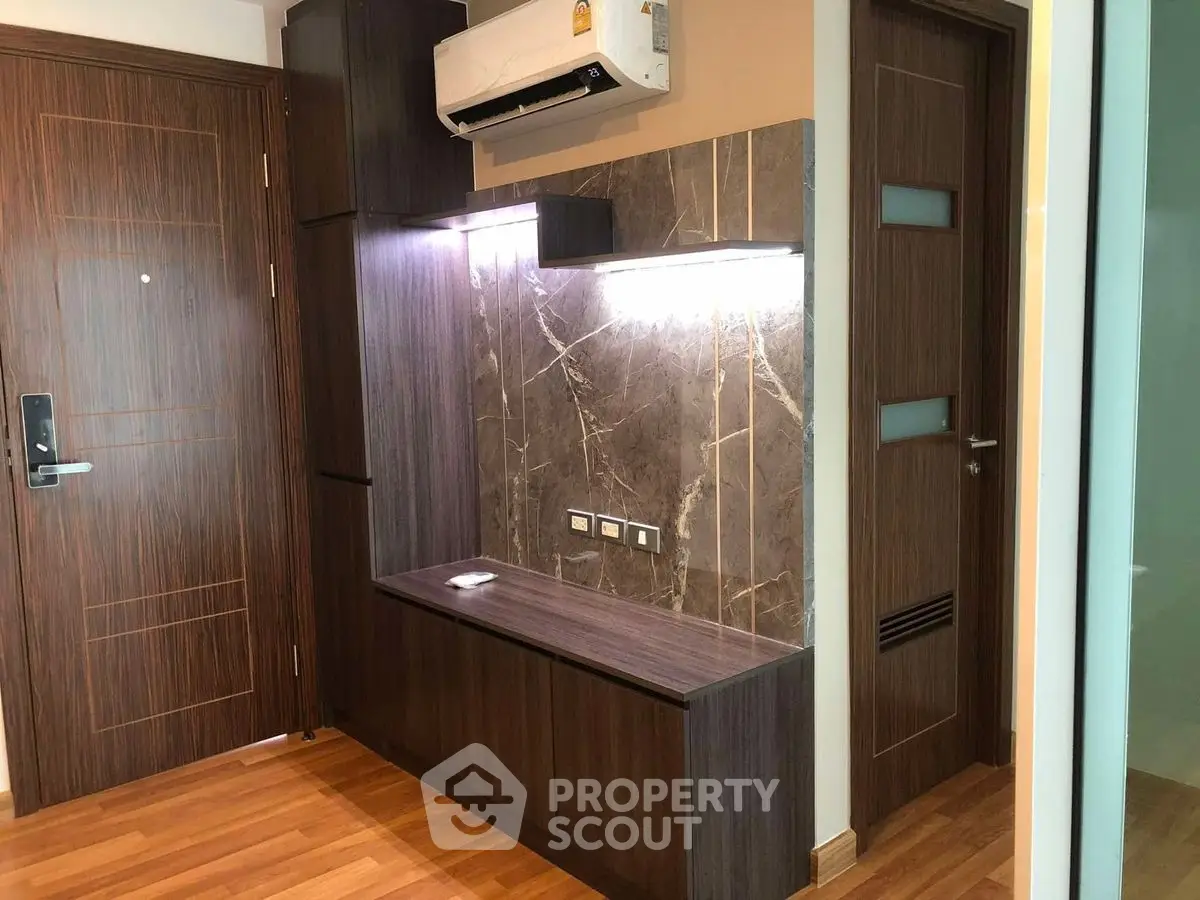 Modern interior with wood paneling and air conditioning unit, featuring sleek design and ambient lighting.