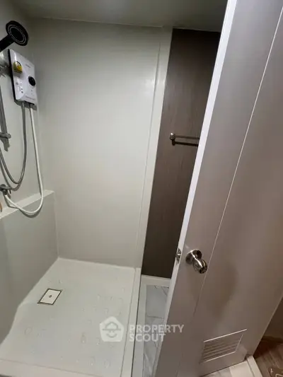Compact modern bathroom with shower and sleek design