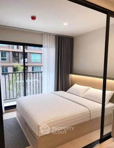 Modern bedroom with balcony view in a stylish apartment