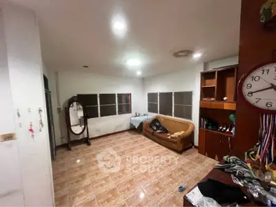 Spacious living room with tiled floor and cozy seating area