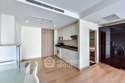 Modern kitchen with sleek appliances and open layout in a stylish apartment