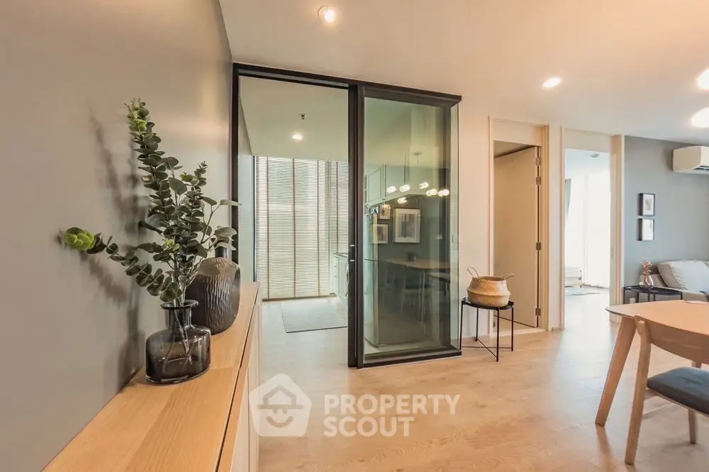 Spacious modern living room with elegant decor and large windows