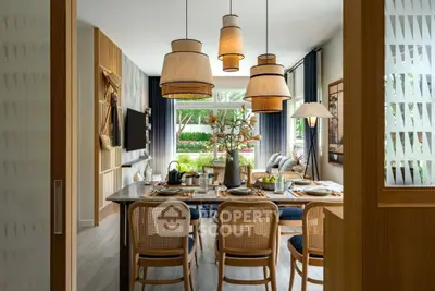 Stylish dining area with modern lighting and garden view