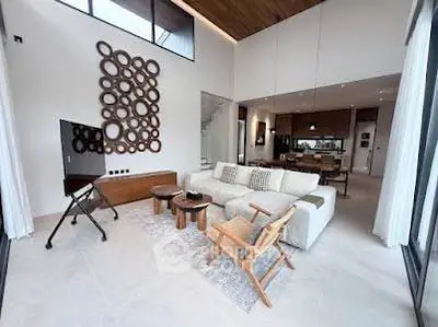 Spacious modern living room with high ceilings and stylish decor