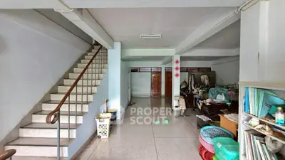 Spacious interior with staircase and open layout, ideal for customization and storage solutions.