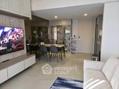 Modern living room with sleek furniture and dining area, perfect for urban living.
