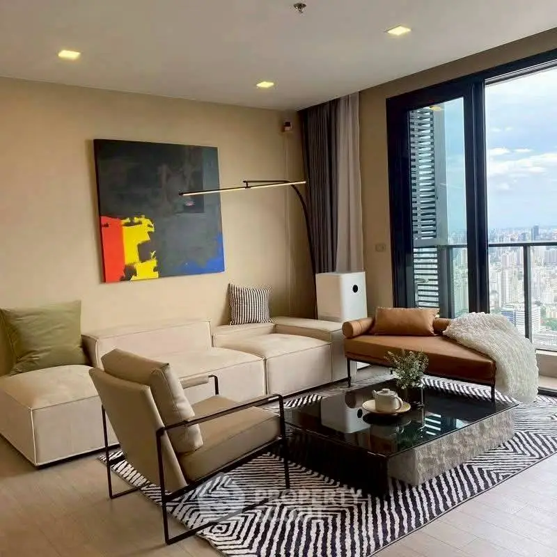 Modern living room with city view, stylish furniture, and abstract art.