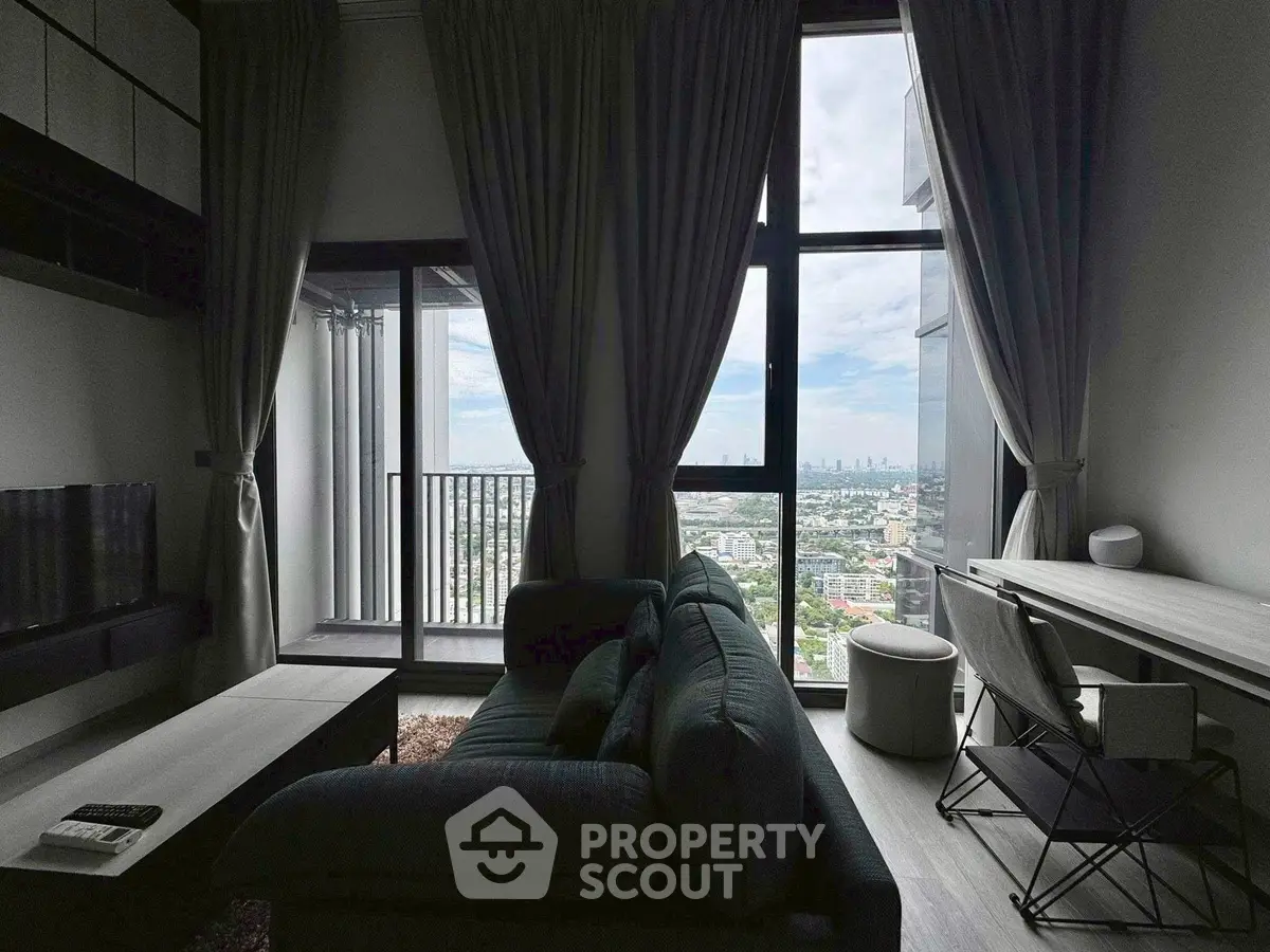 Modern living room with city view and balcony access
